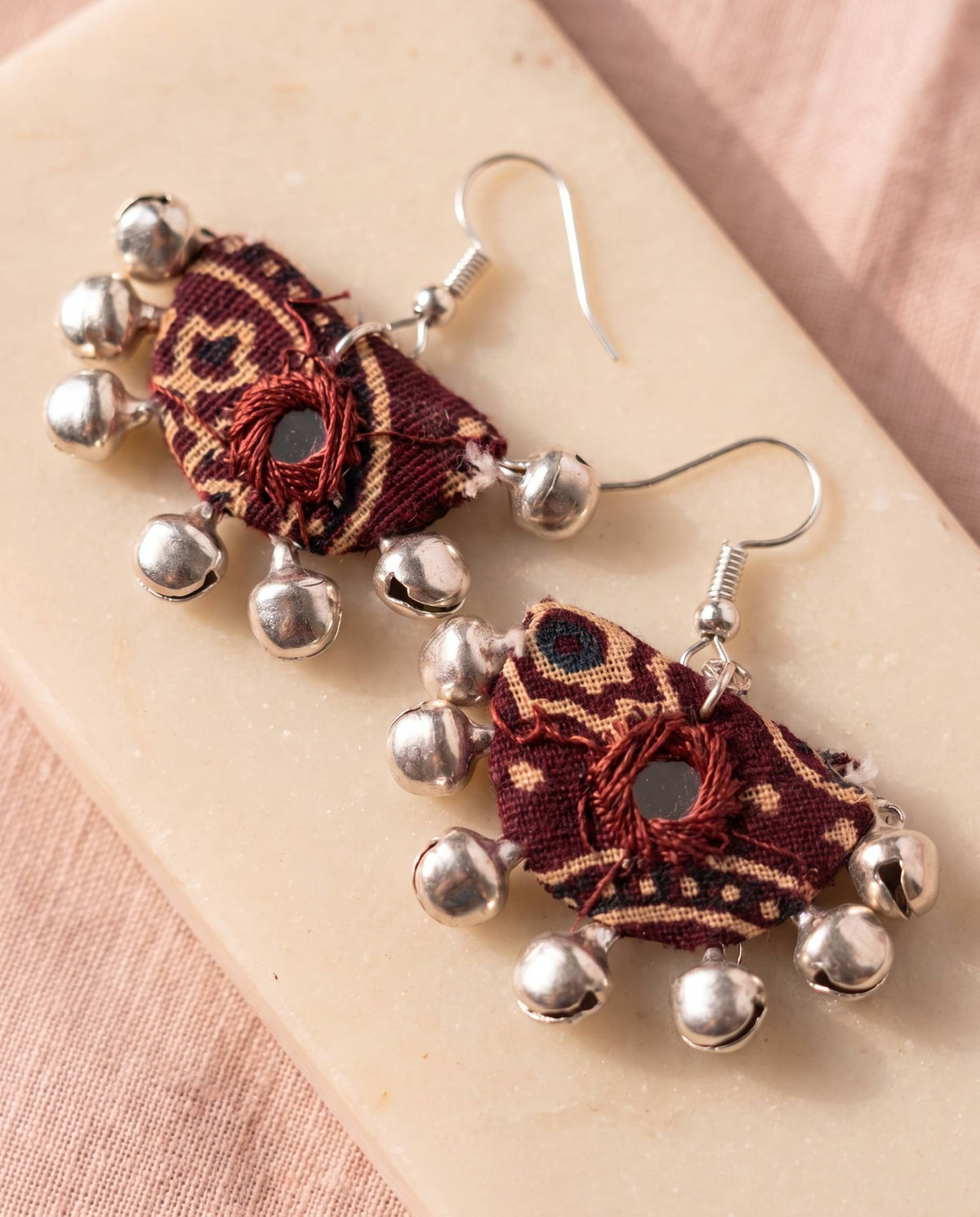 Handmade maroon block-print fabric half-moon earrings with mirror work and silver ghungroo bells by KEVILAGU