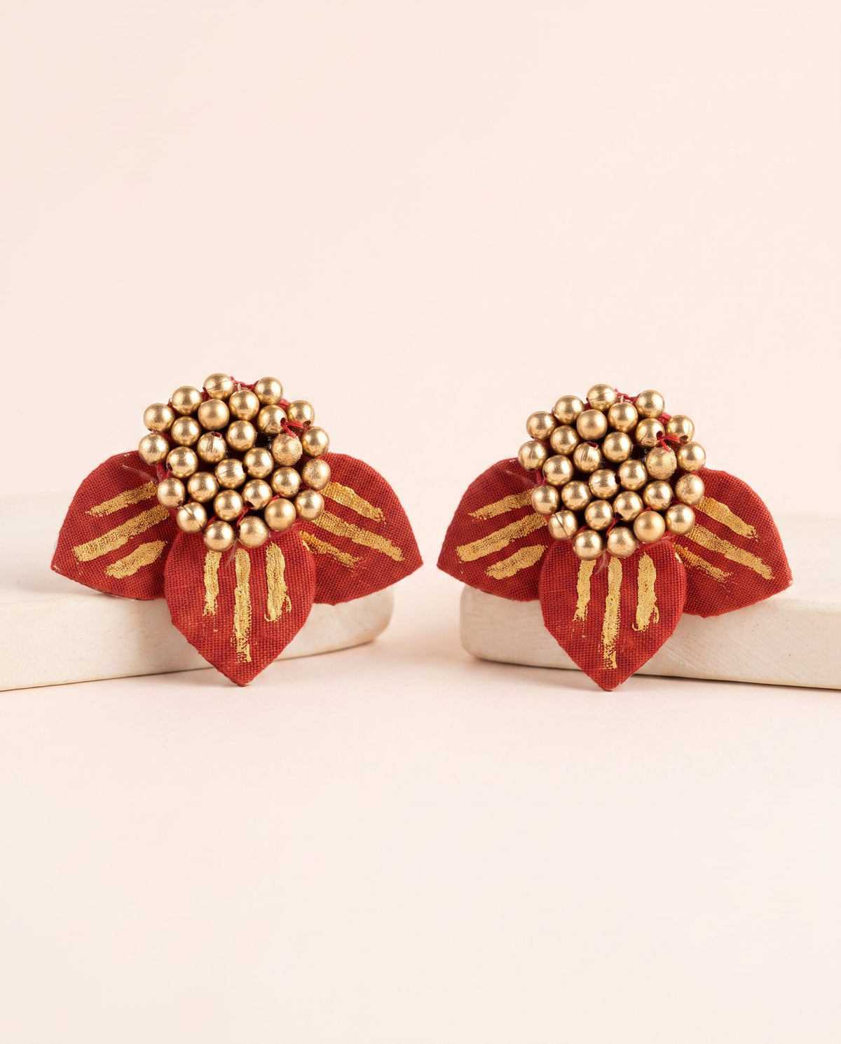 Handmade red fabric petal stud earrings with gold brush strokes and gold bead cluster by KEVILAGU