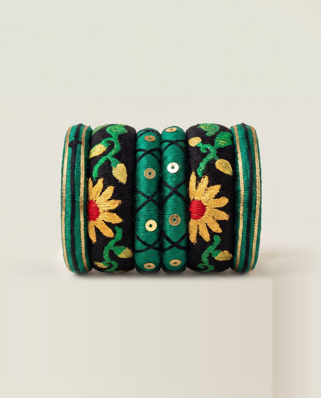 Green and black silk thread bangle set with embroidered sunflowers and gold sequins