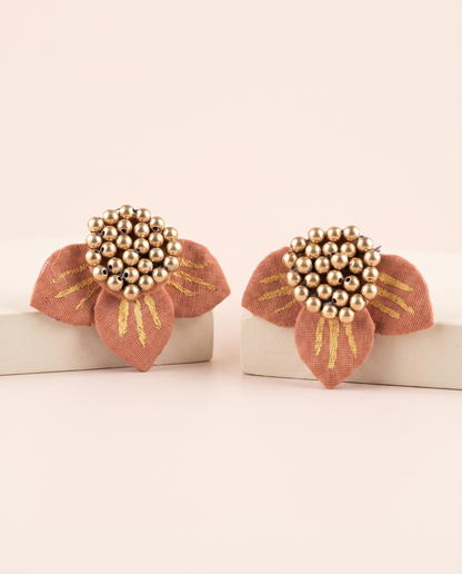 Handmade peach fabric floral stud earrings by KEVILAGU with gold stripe detailing and gold bead cluster