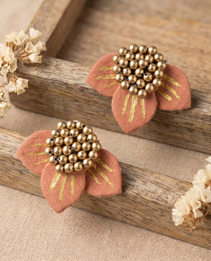 Handmade peach fabric floral stud earrings by KEVILAGU with gold stripe detailing and gold bead cluster