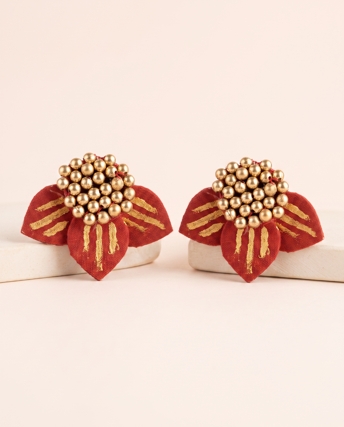 Handmade red fabric floral stud earrings by KEVILAGU with gold thread detailing and gold bead cluster