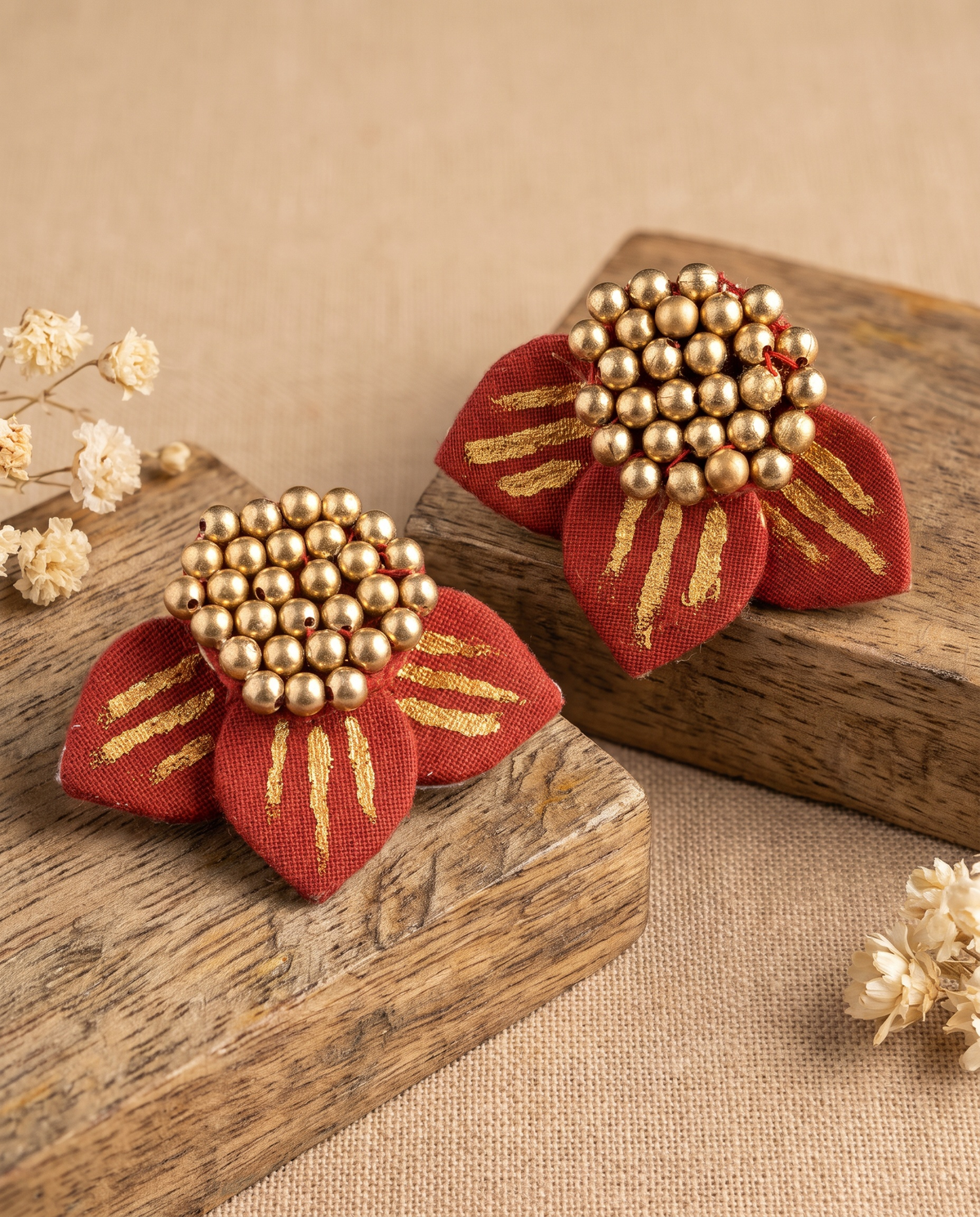 Handmade red fabric floral stud earrings by KEVILAGU with gold thread detailing and gold bead cluster