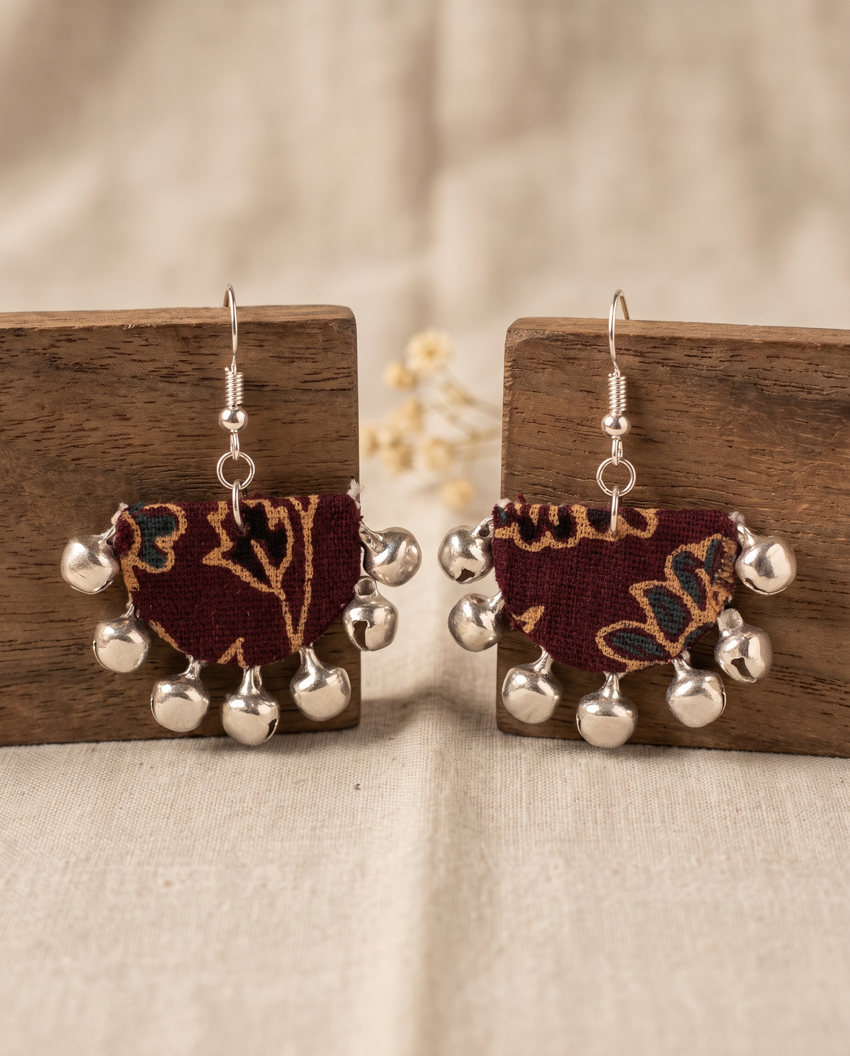 Handmade maroon, mustard & navy floral block-print fabric ghungroo dangle earrings by KEVILAGU with silver bell fringe
