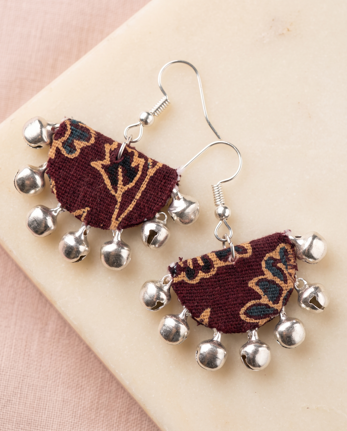 Handmade maroon, mustard & navy floral block-print fabric ghungroo dangle earrings by KEVILAGU with silver bell fringe