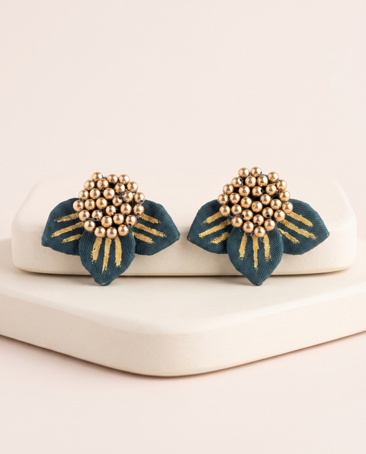 Handmade teal fabric floral stud earrings by KEVILAGU with gold bead detailing