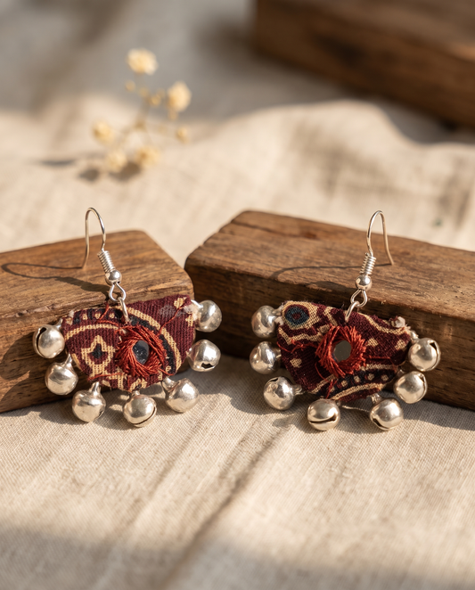 Handmade maroon & beige block-print fabric ghungroo dangle earrings by KEVILAGU with mirror-work accent and silver bell fringe