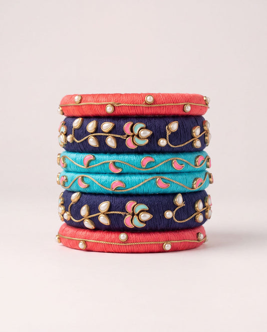 Red, navy, and turquoise silk thread bangle set with meenakari floral pearl detailing
