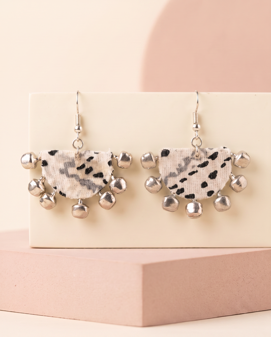 Handmade white, grey & black abstract print fabric ghungroo dangle earrings by KEVILAGU with silver bell fringe