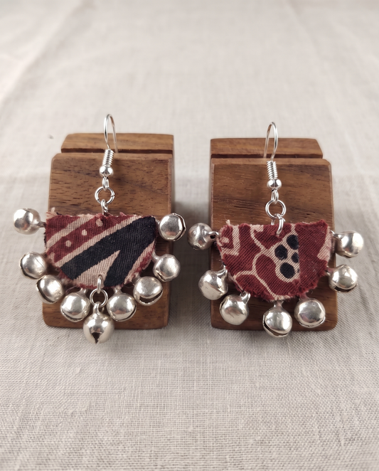 Handmade maroon, black & beige block-print fabric ghungroo dangle earrings by KEVILAGU with silver bell fringe