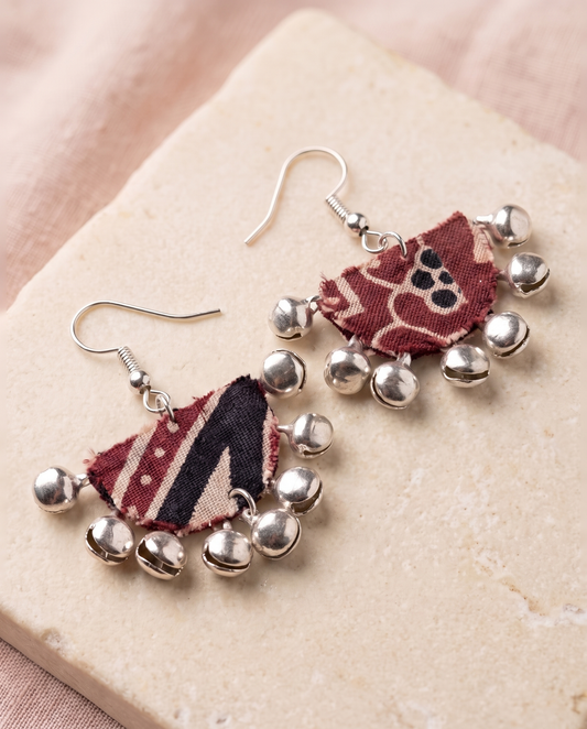 Handmade maroon, black & beige block-print fabric ghungroo dangle earrings by KEVILAGU with silver bell fringe