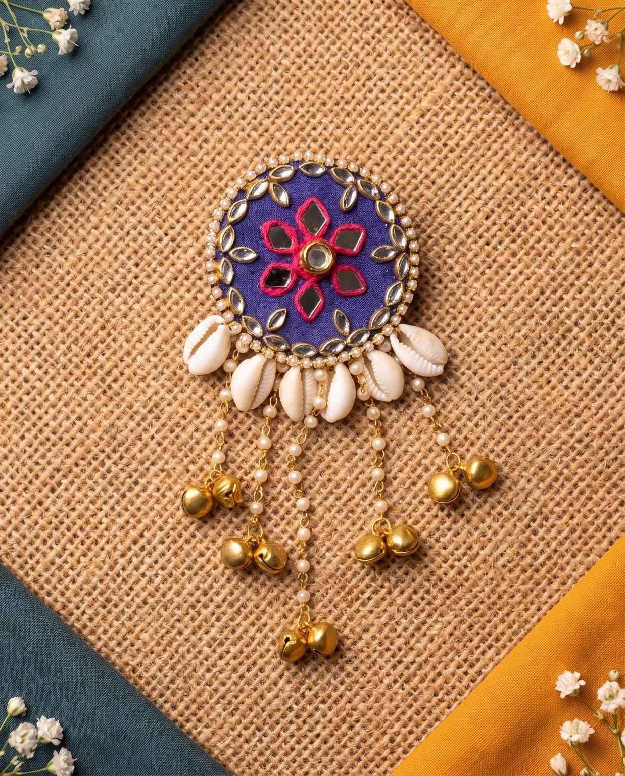 Neelika royal blue cowrie hair brooch with pink thread floral work and mirror embellishments