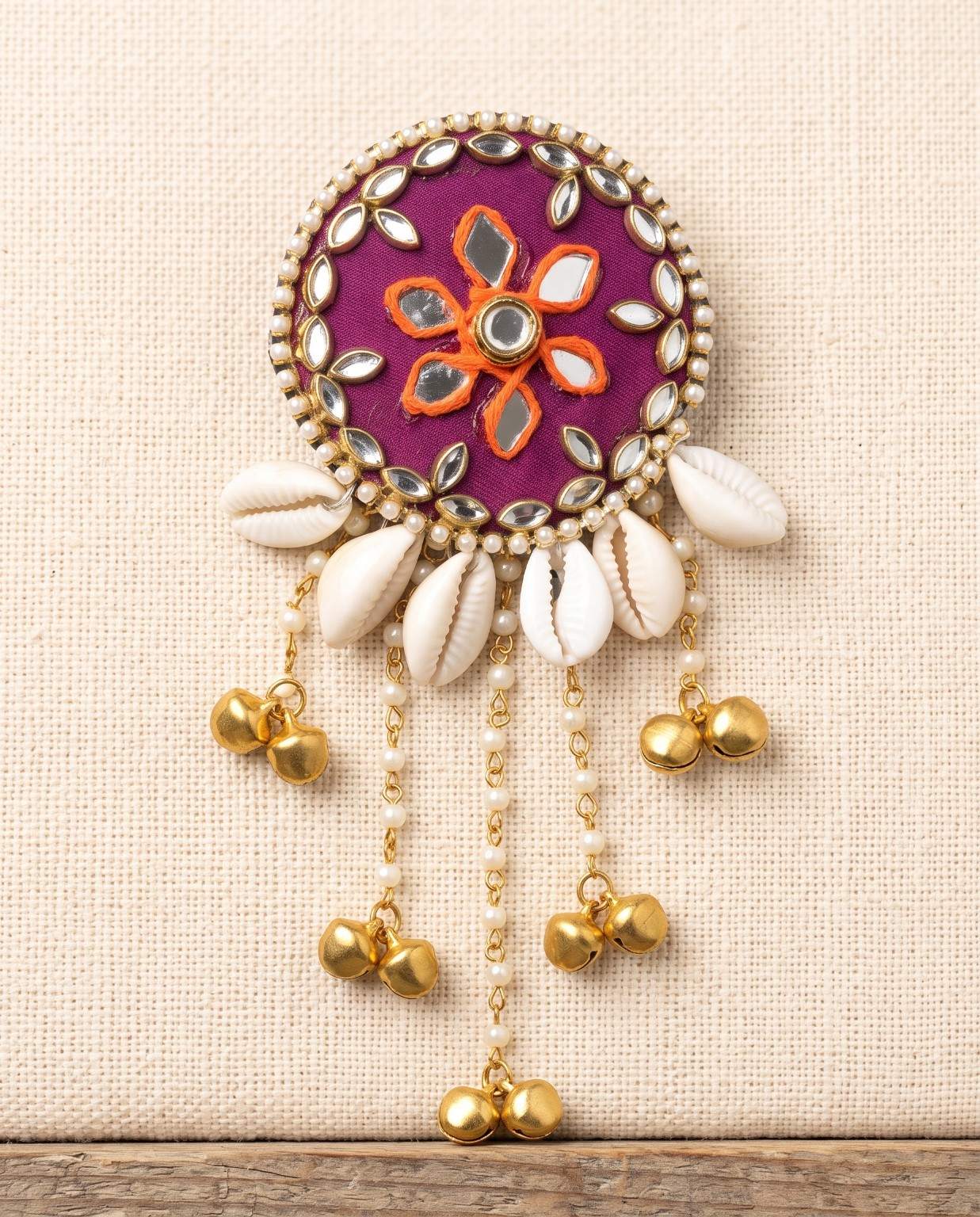 Rangili magenta mirror hair brooch with orange floral embroidery and cowrie shell detailing